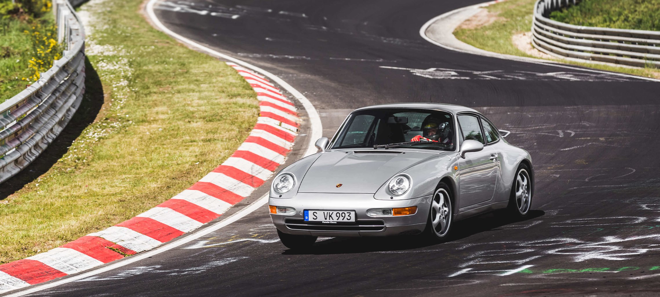 A Porsche on the race track at a trackday