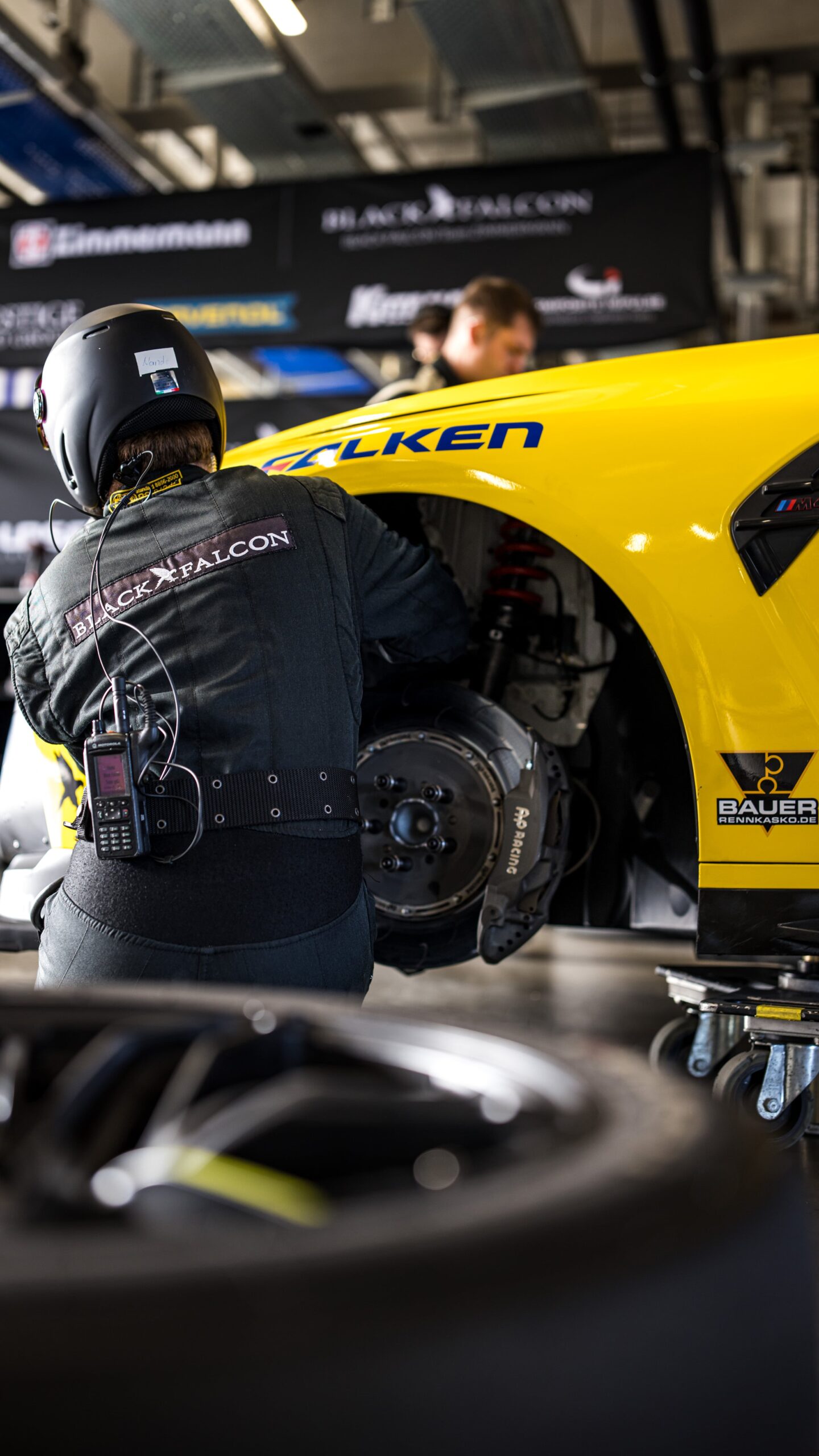 Mechatronics technician changing tyres on the BILSTEIN Race Car